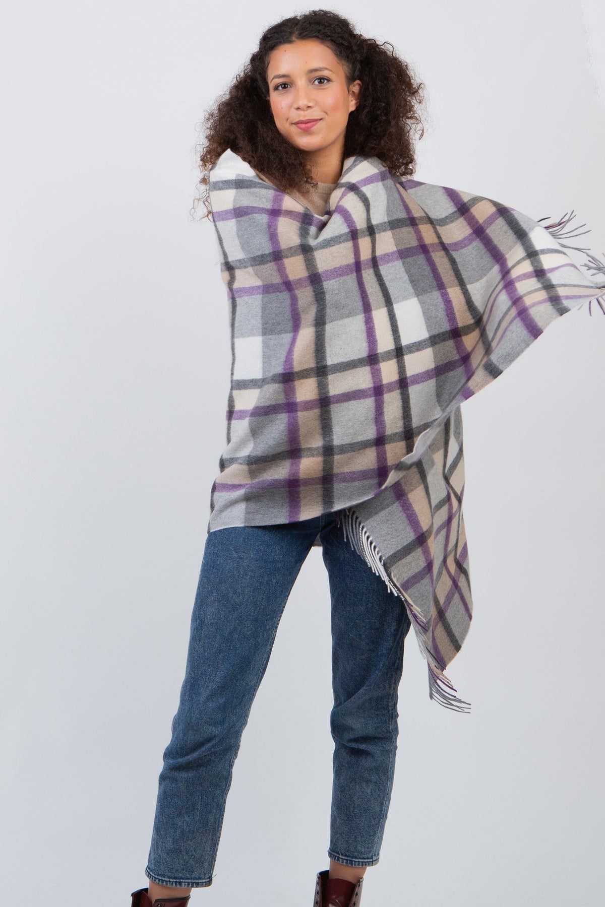 Princeton Check Cashmere Stole in Lavender, a grey, beige, and purple plaid wrap with fringed edges, styled as a poncho