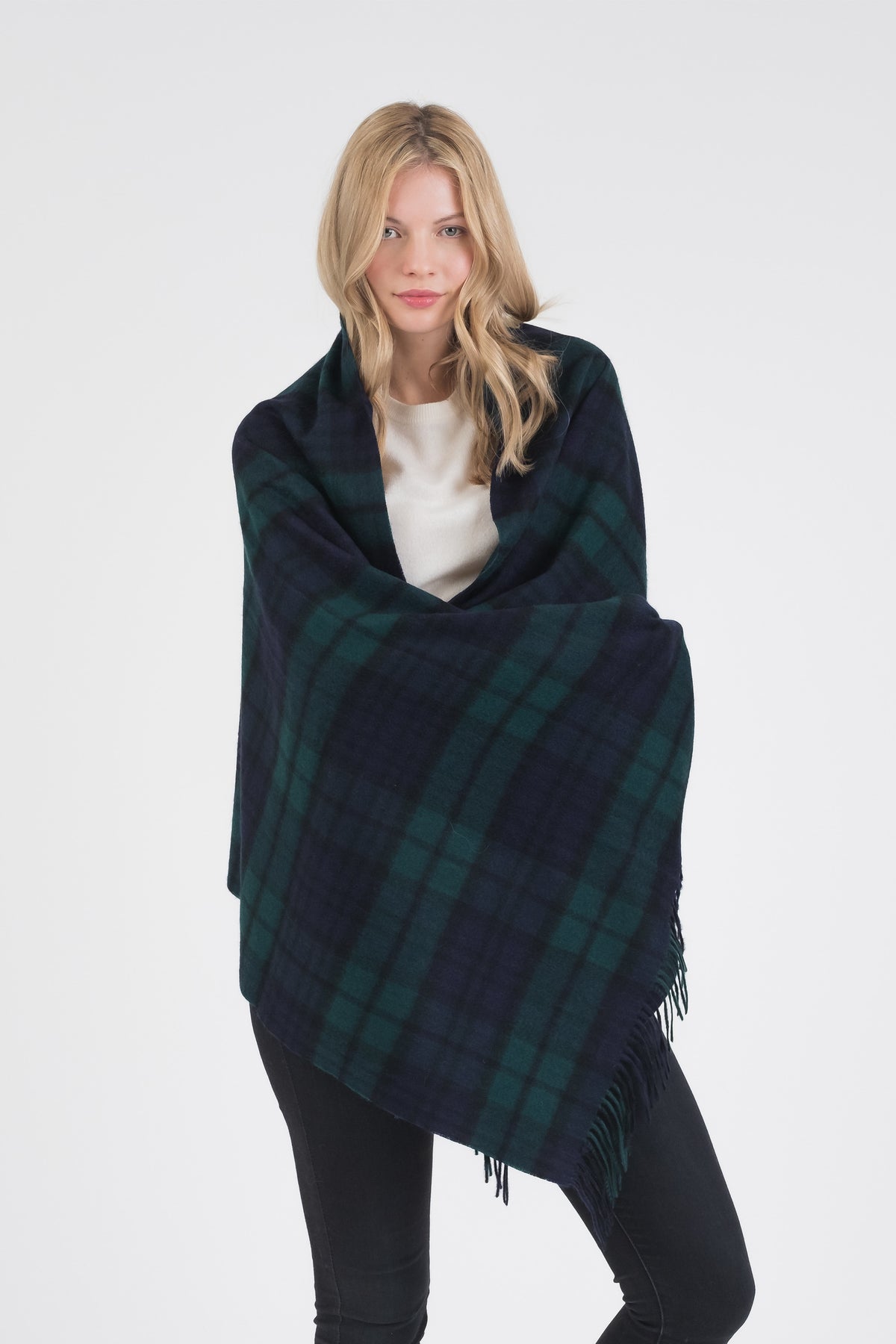 Heritage Tartan Cashmere Stole in Blackwatch worn wrapped around shoulders, showing full drape and fringed edges