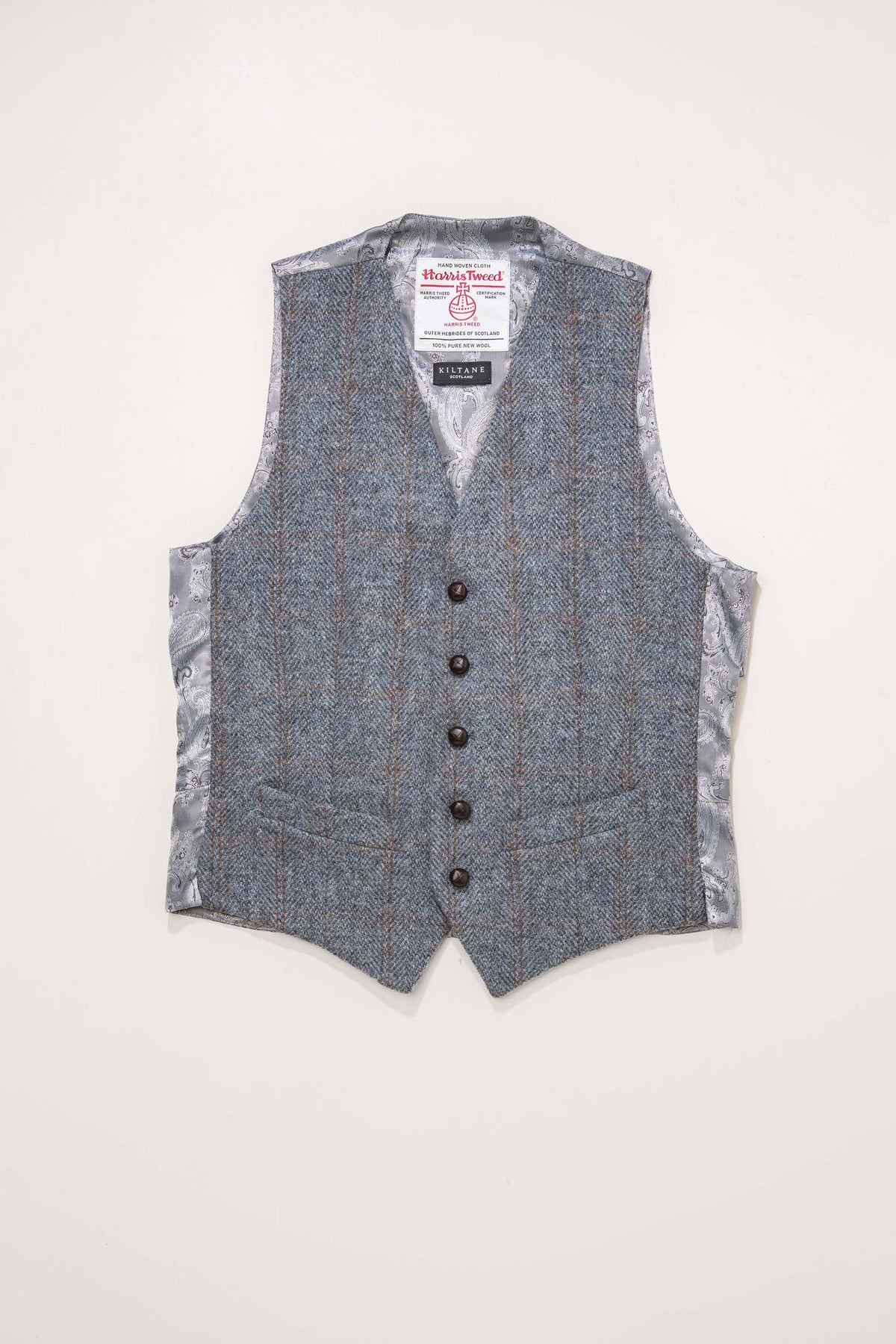 Harris Tweed Iain Waistcoat in mid blue brown windowpane laid flat, showing front with five buttons and paisley satin lining