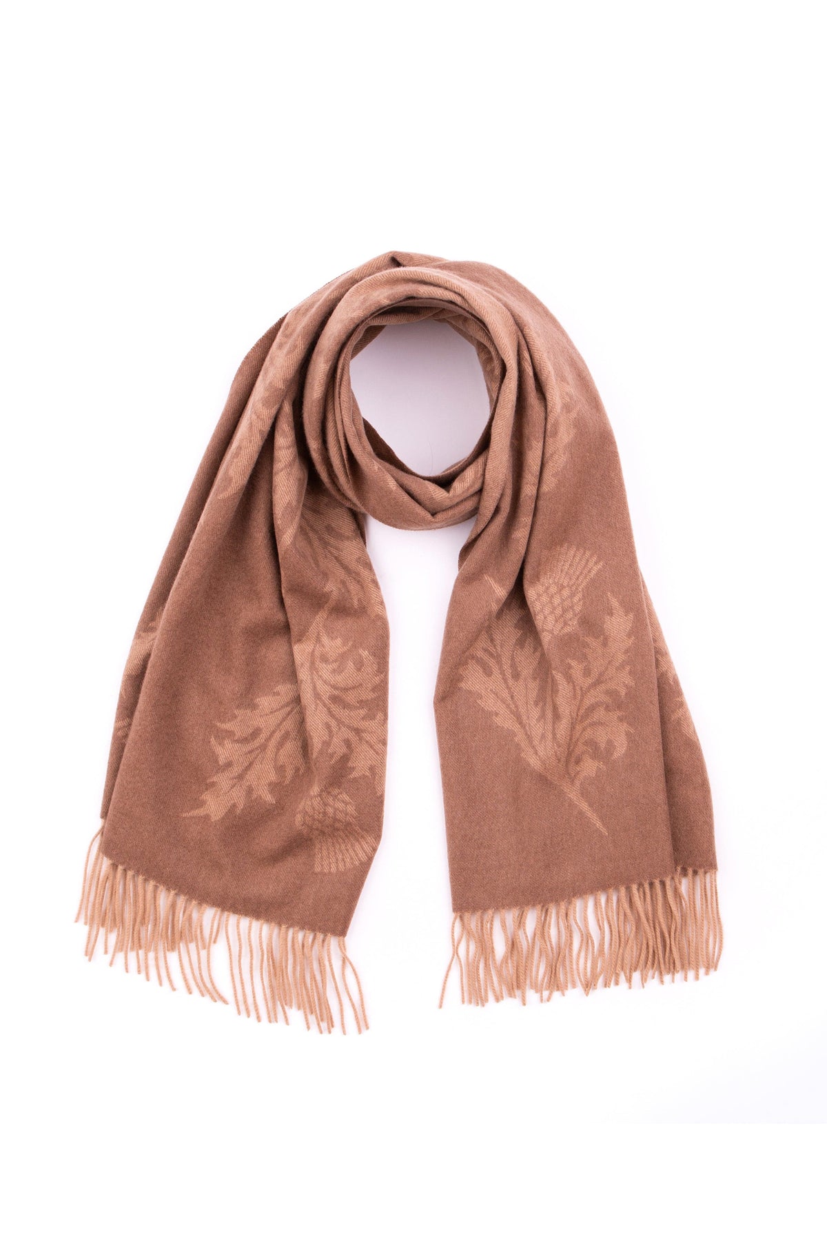 Jacquard Cashmere Stole in camel, draped with looped centre showing tonal thistle pattern and fringed ends
