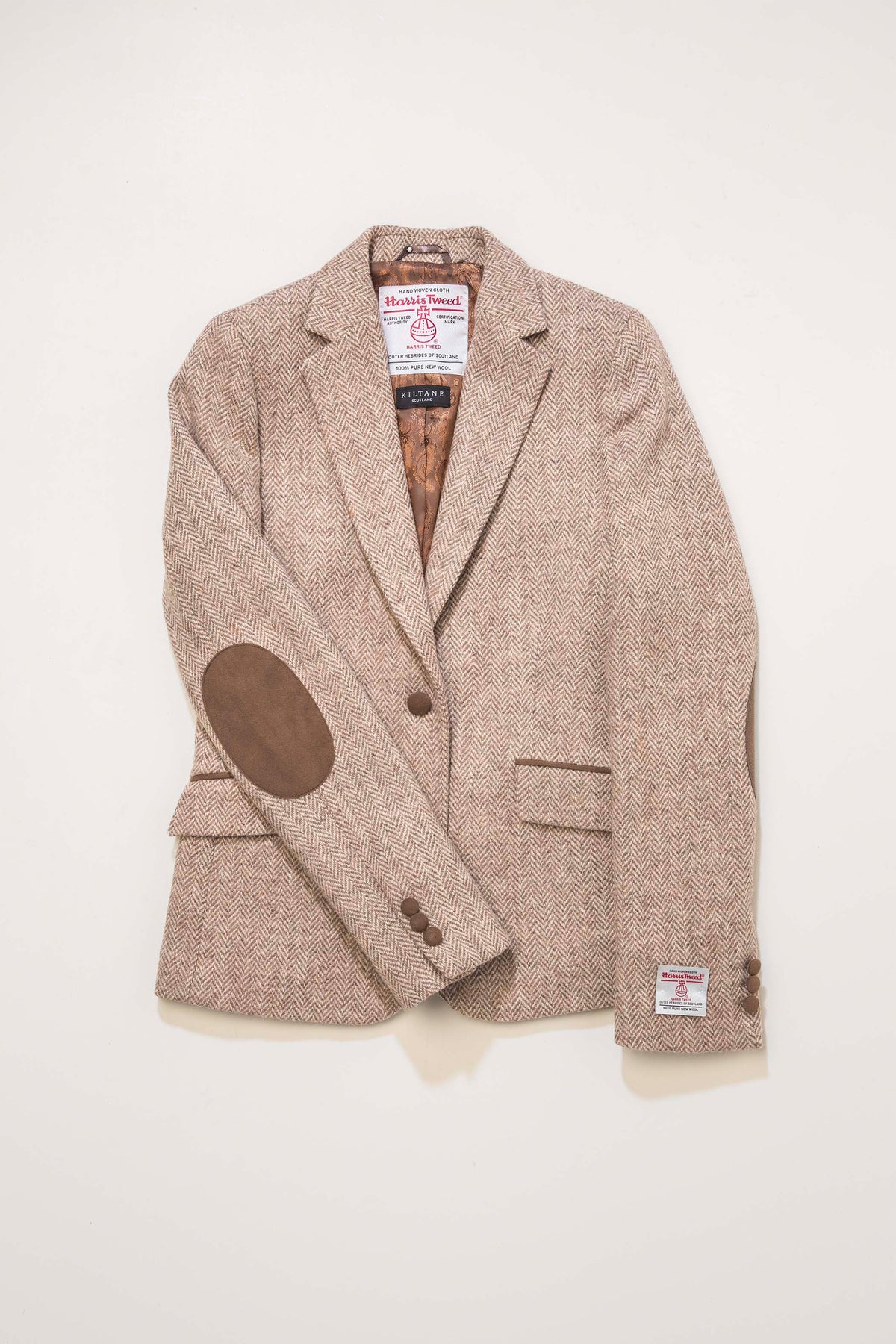 Women's Harris Tweed Janice Blazer in light beige herringbone, open front showing brown suede elbow patches and Kiltane lining