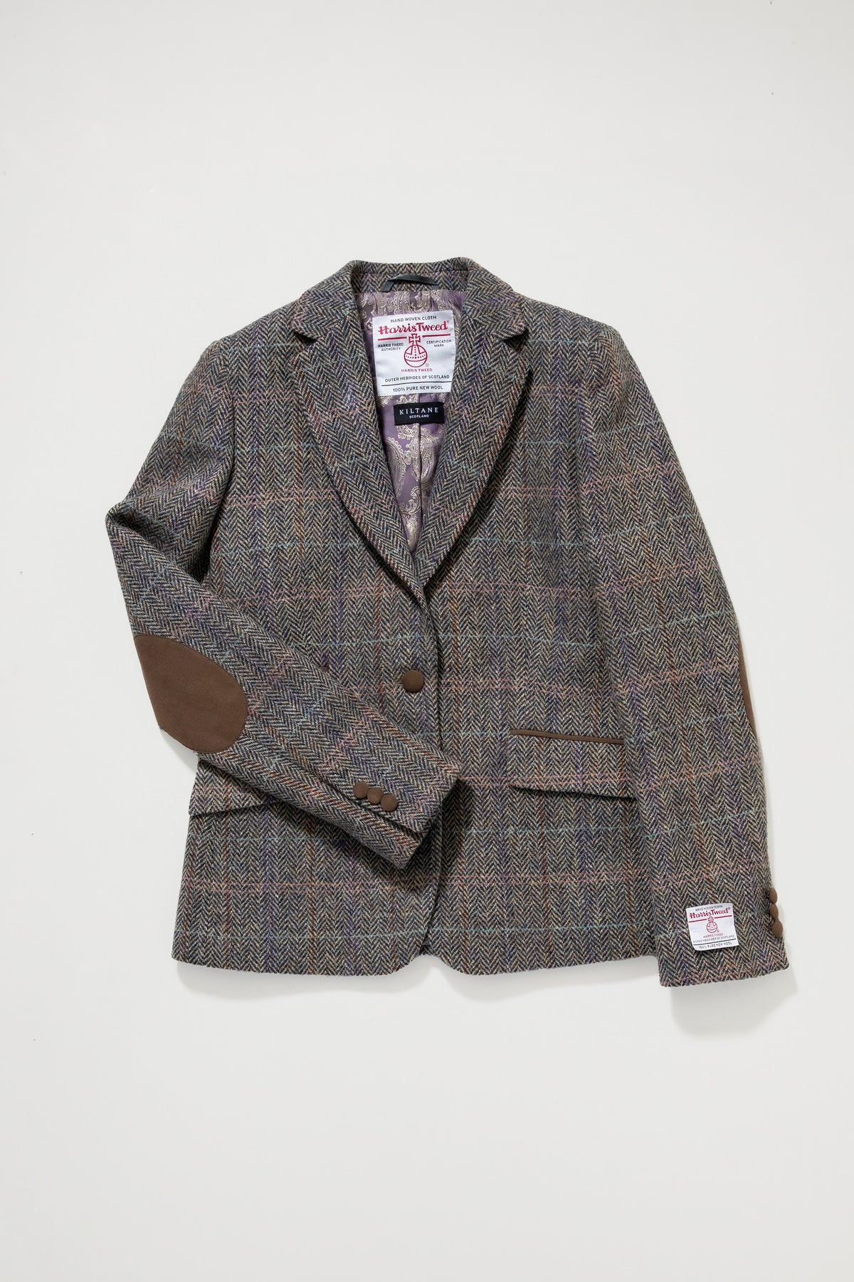Women's Harris Tweed Janice Blazer in natural check laid flat, showing brown suede elbow patches and satin lining