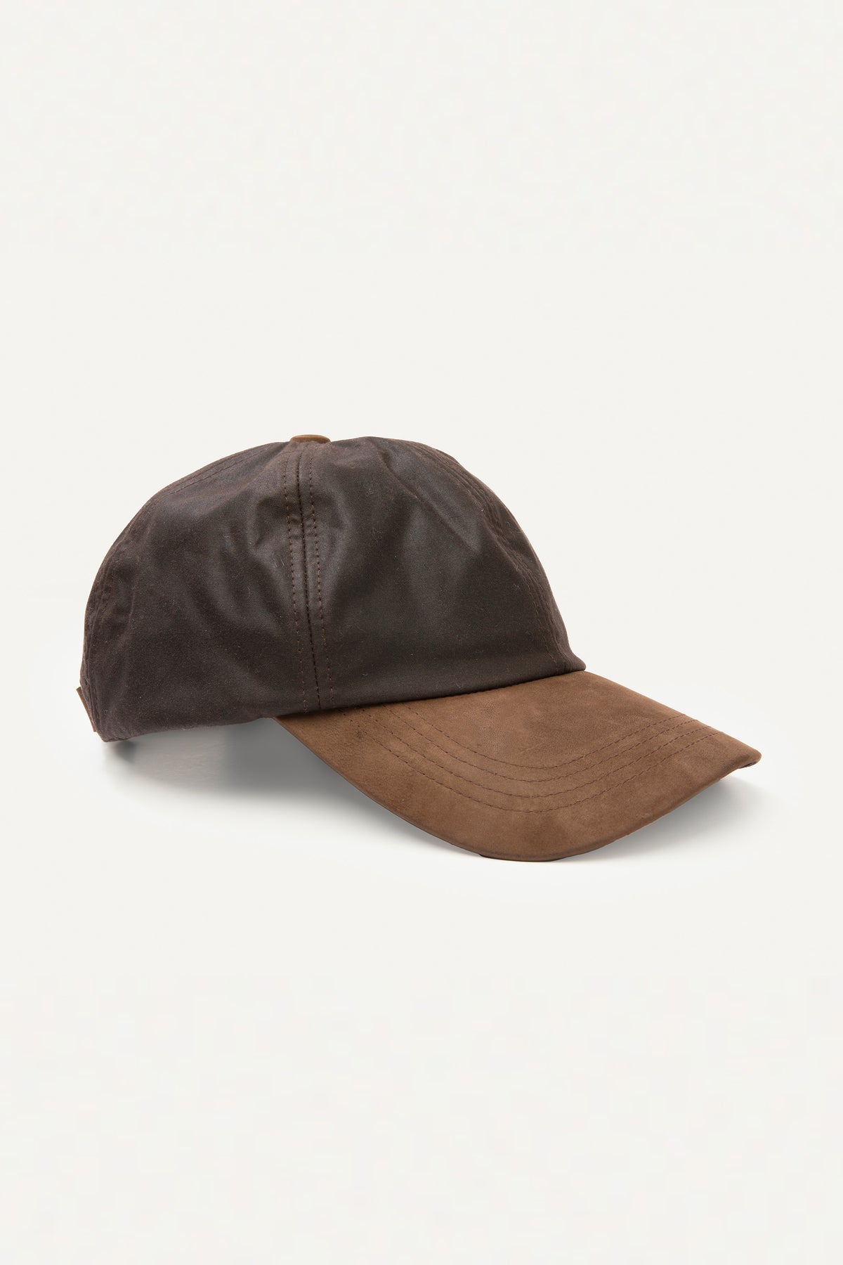 Wax Baseball Cap in brown, three-quarter front view showing dark waxed cotton crown and tan suede brim with stitched detailing