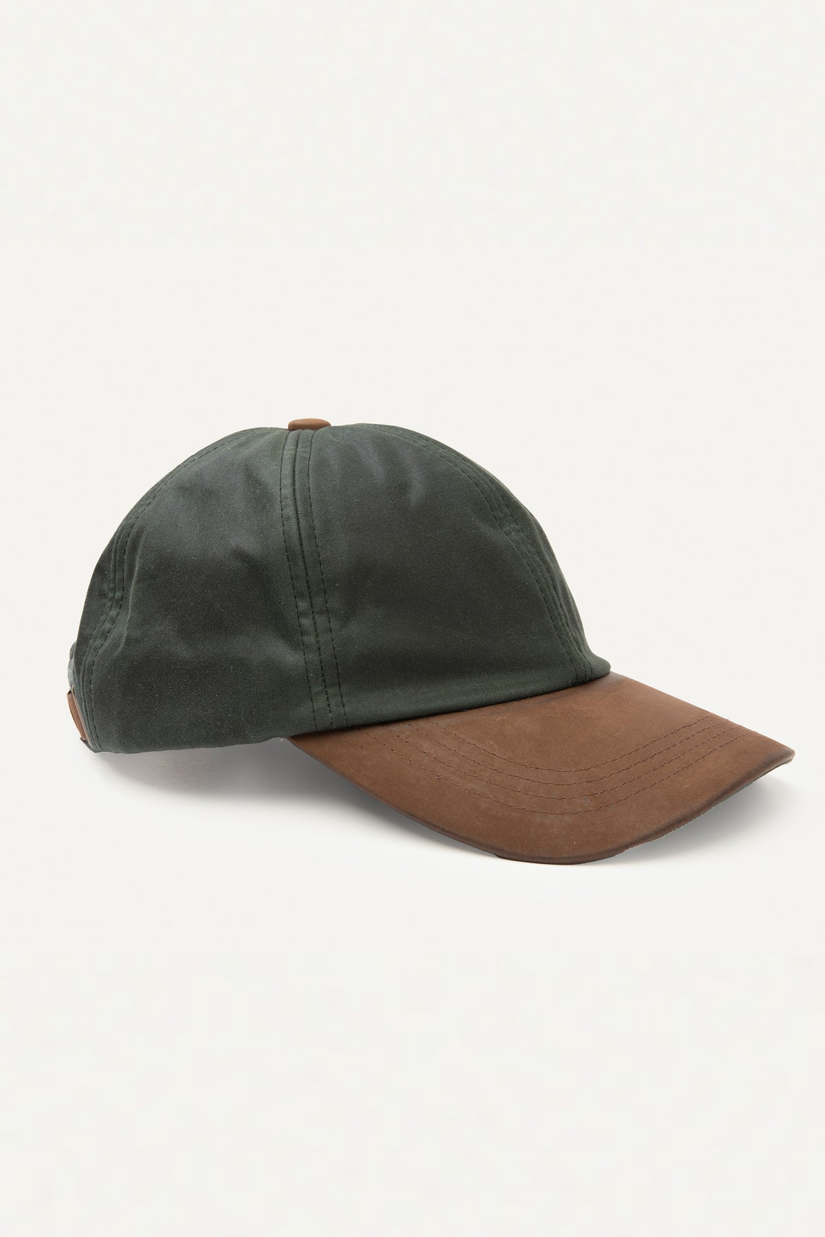 Wax Baseball Cap in olive with brown suede peak, side profile showing stitched panel detail and leather button top