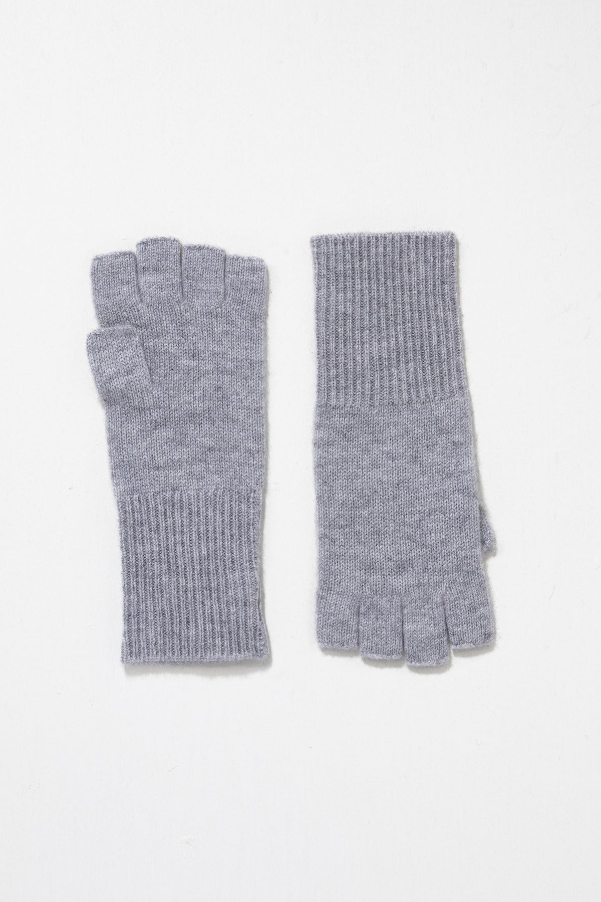 Cashmere Fingerless Gloves in Oyster Grey, soft knit pair laid flat showing ribbed cuffs and half-finger design