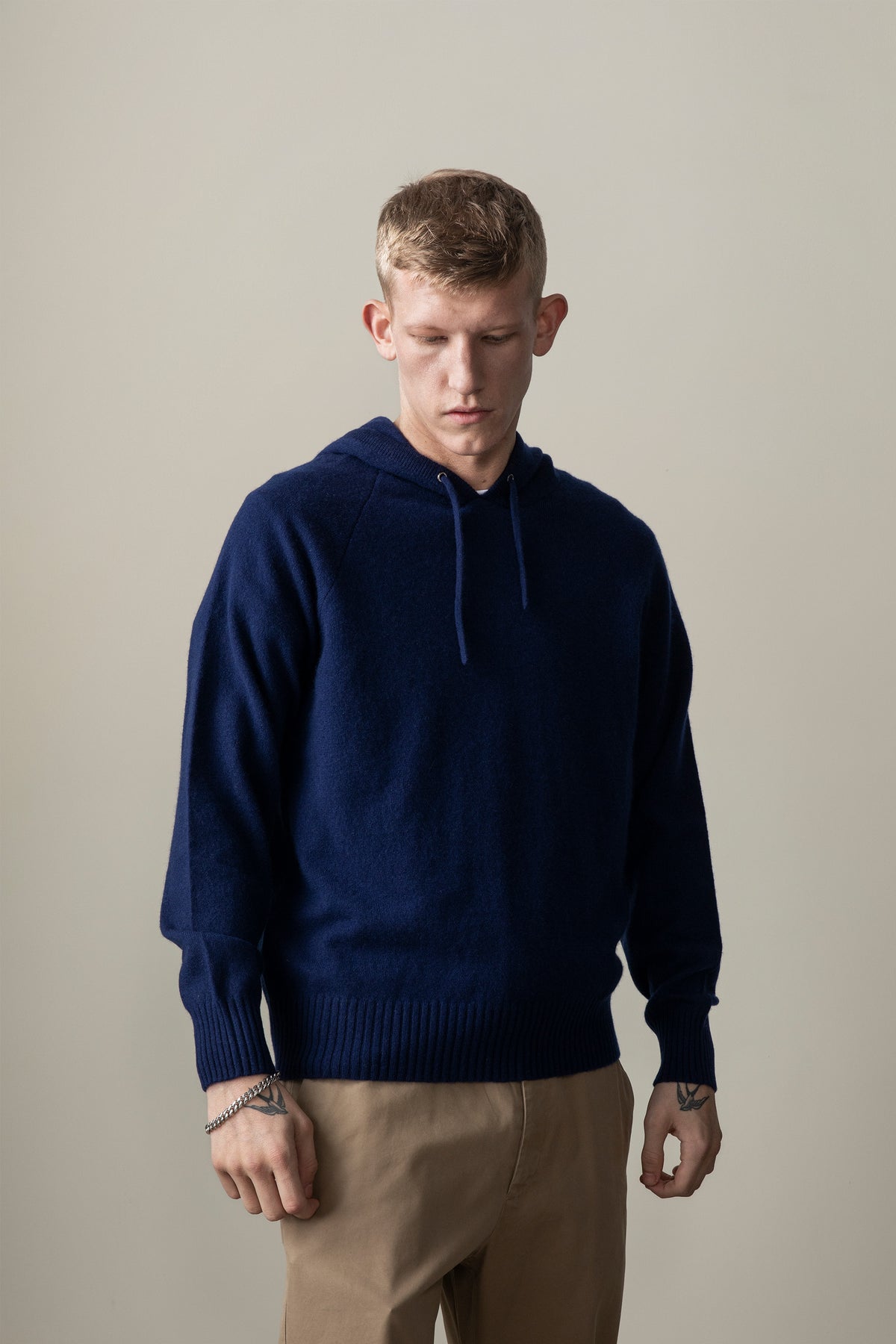 Unisex Cashmere Hoodie in Eclipse navy blue with drawstring hood, ribbed cuffs and hem, relaxed oversized fit