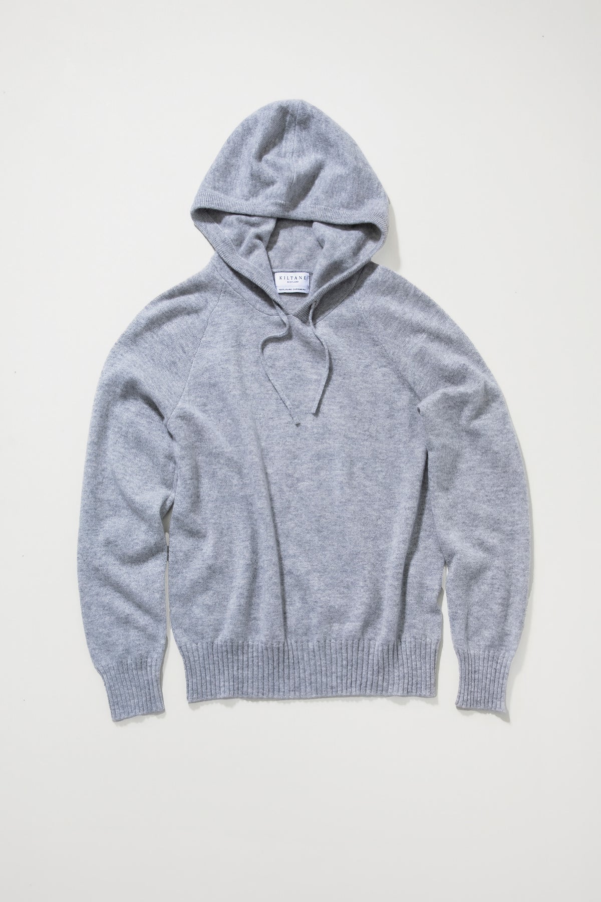 Kiltane Unisex Cashmere Hoodie in Light Grey laid flat, showing front view with V-neck detail and ribbed cuffs and hem
