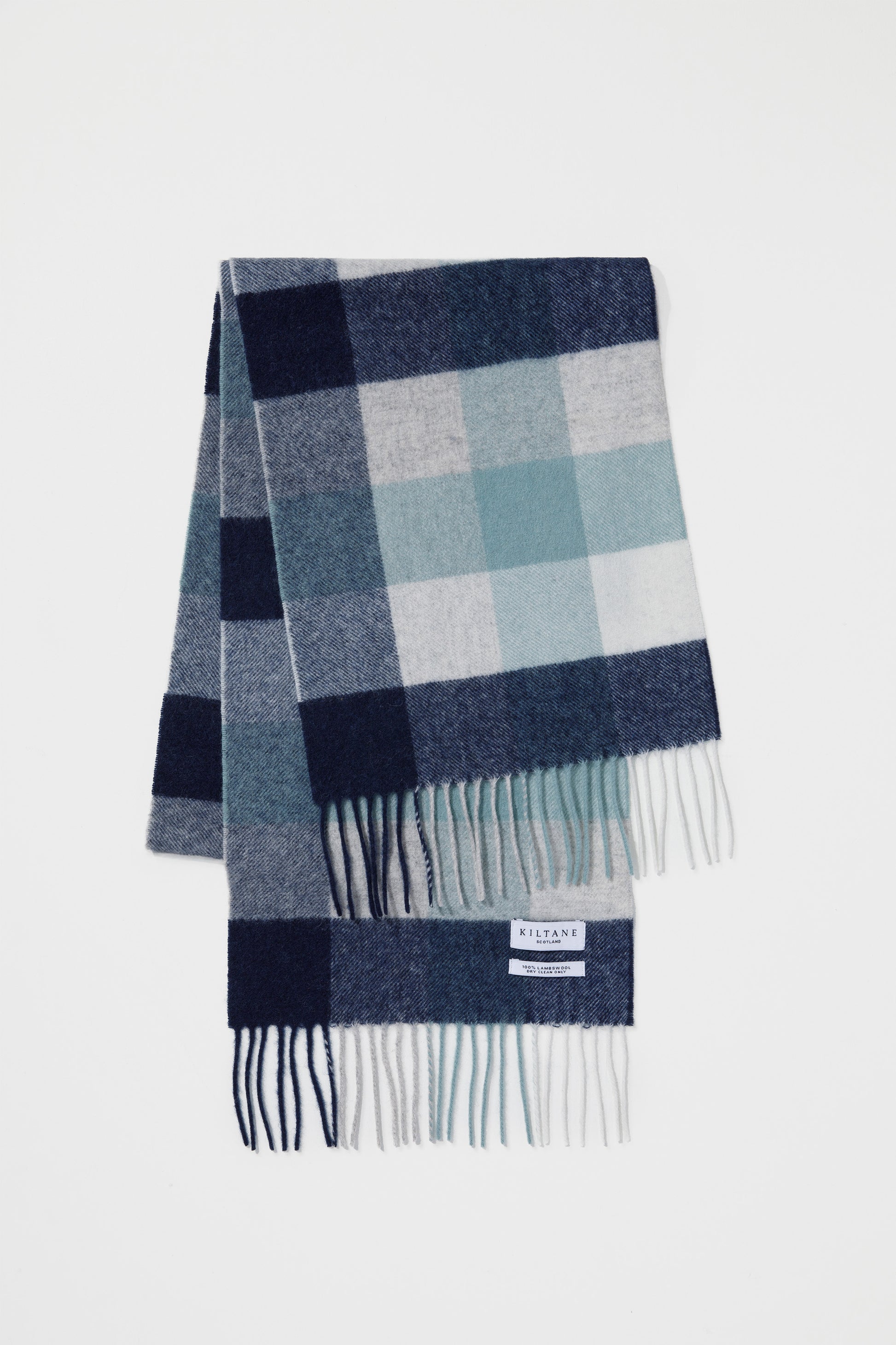 Kiltane Checkers Lambswool Scarf in Navy Brume, featuring navy, sage green, and cream check pattern with fringed ends
