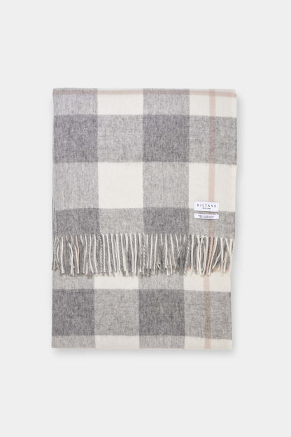 Kiltane Lambswool Throw in Grey Plaid Check, folded to show large check pattern with fringed edges