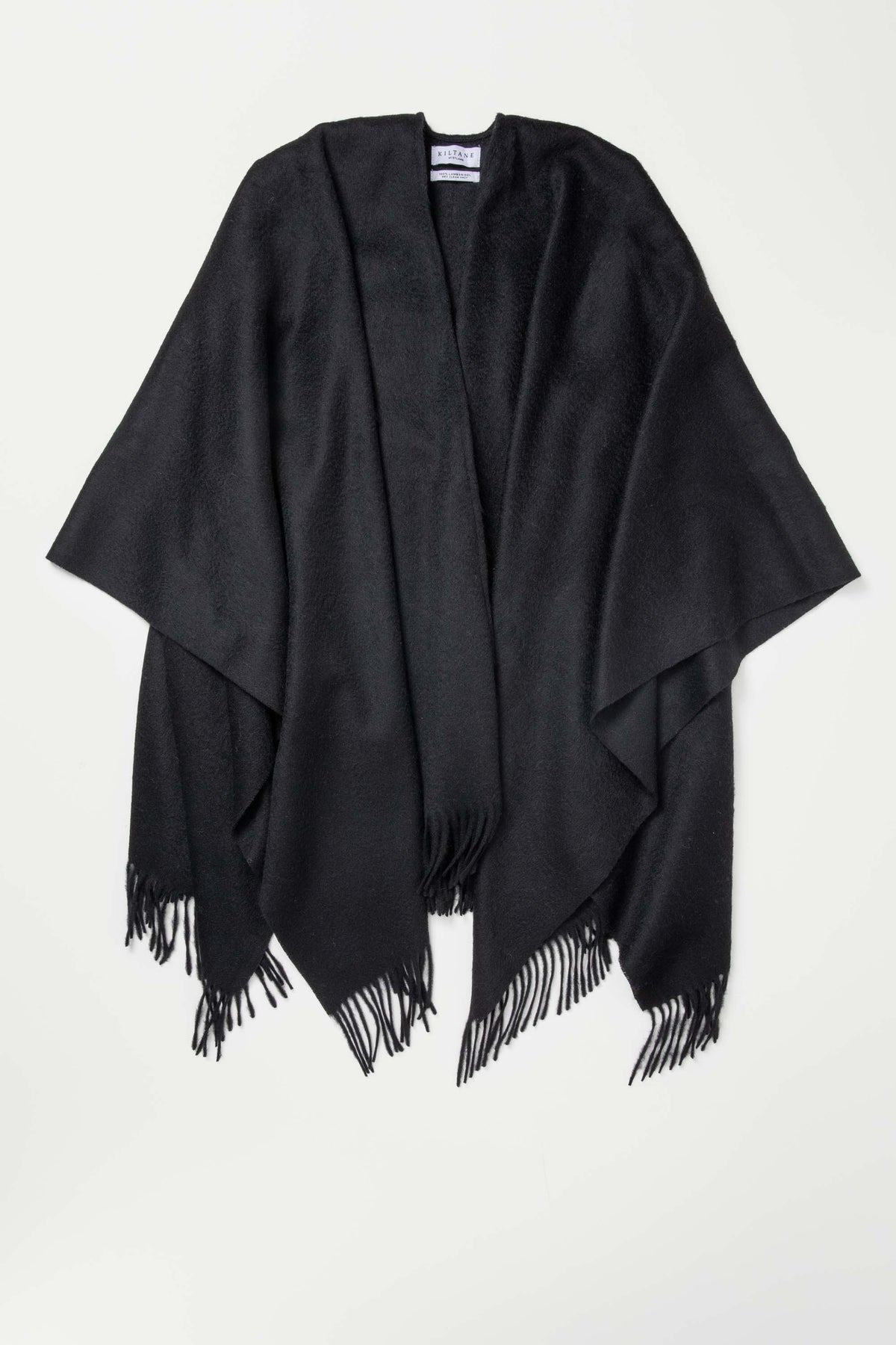 Solid Lambswool Wrap in black laid flat showing open-front drape and fringed hem detail with Kiltane brand label