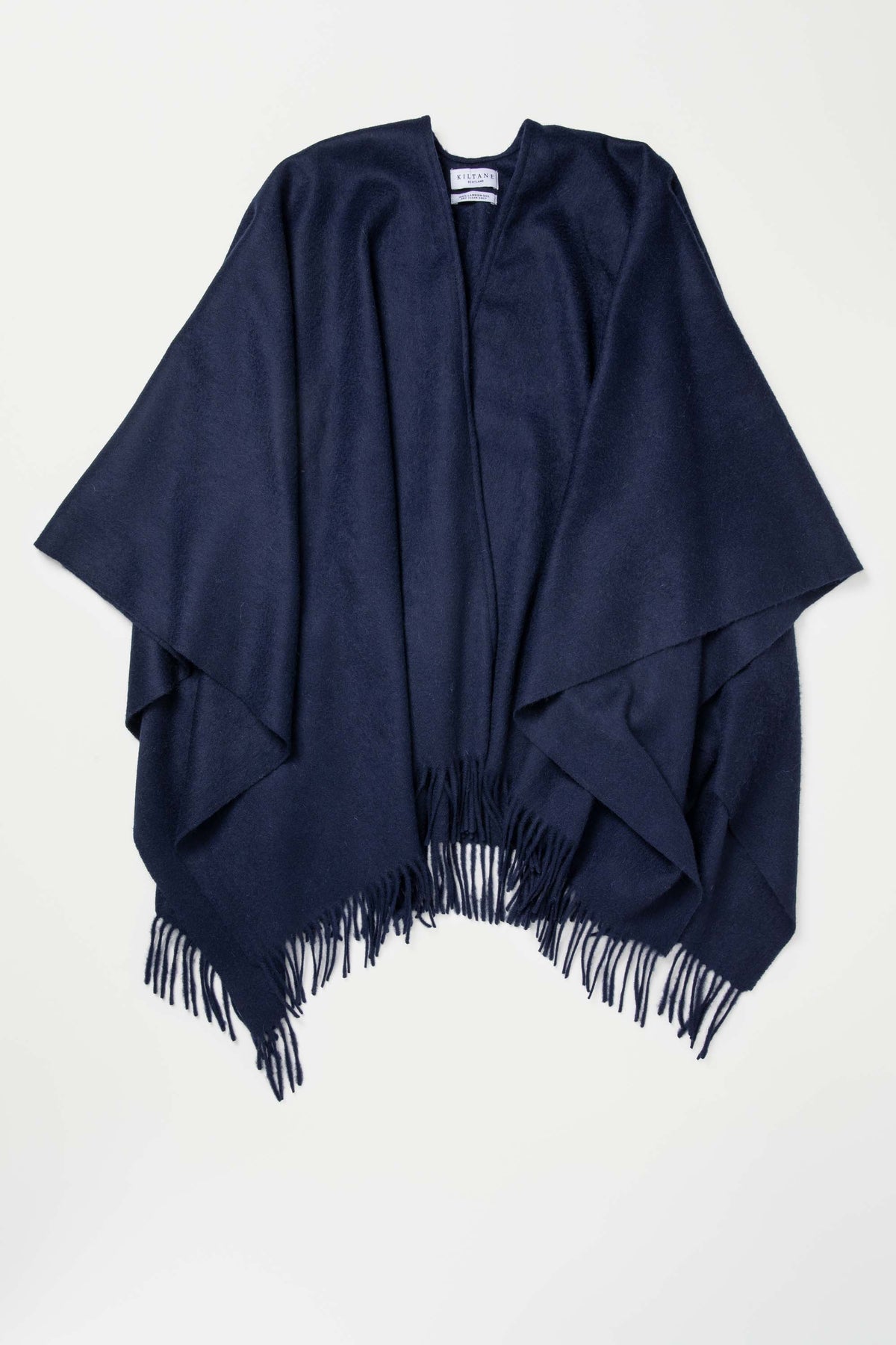 Kiltane Solid Lambswool Wrap in Dark Navy laid flat showing open-front drape and fringed hem detail