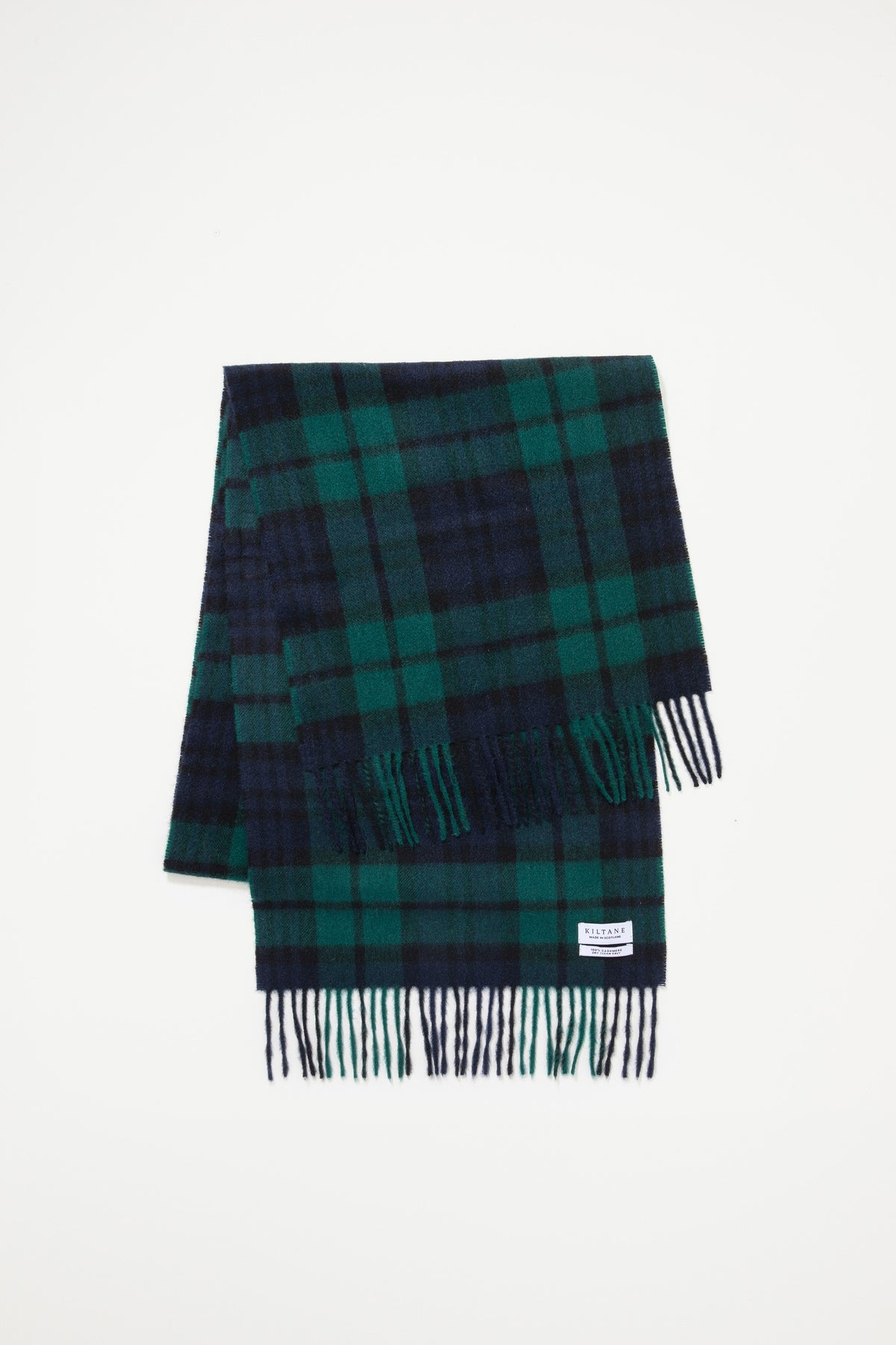 Kiltane Heritage Cashmere Wide Scarf in Blackwatch tartan folded flat showing green and navy plaid pattern with fringed ends