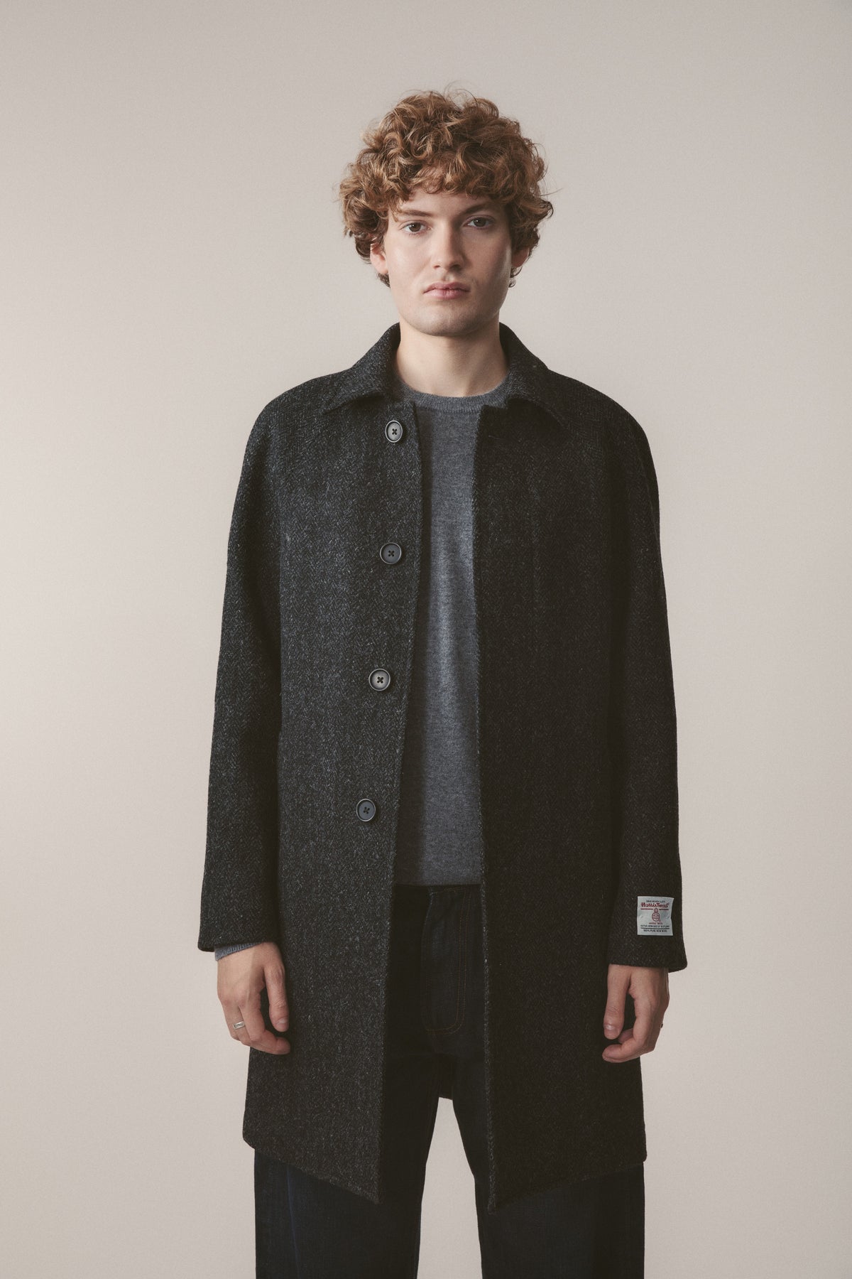 Men's Harris Tweed Ottavio Pea Coat in Deep Charcoal worn open, showing button-front placket and spread collar