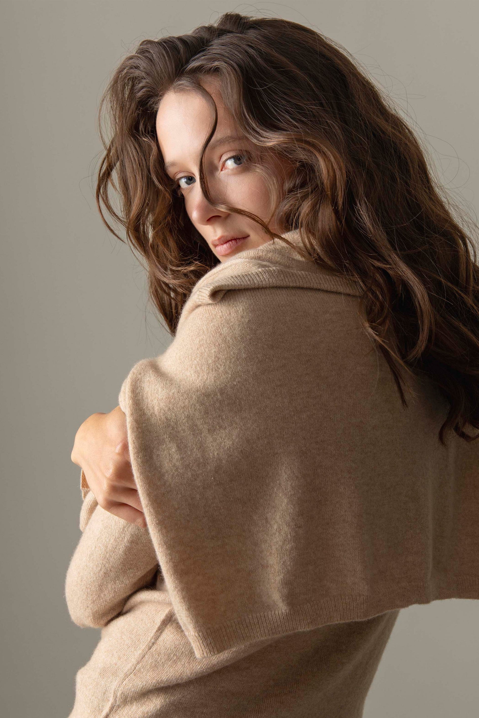 Back view of the Women's Cashmere High Button Cardigan in Vicuna, showing soft knit texture and raised collar detail