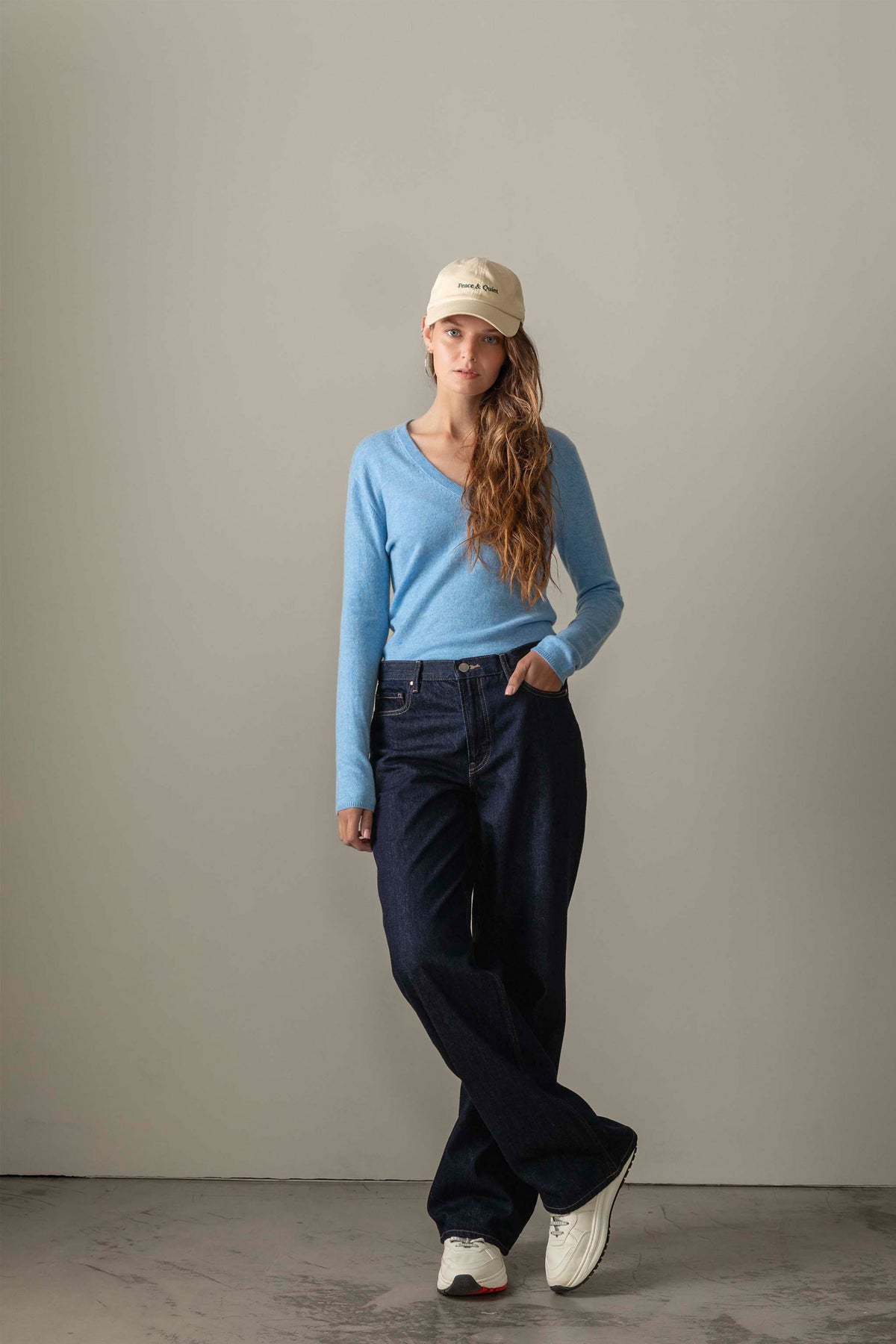Women's Cashmere V Neck Jumper in Glacier blue, lightweight soft knit with a relaxed fit, styled with dark wide-leg jeans