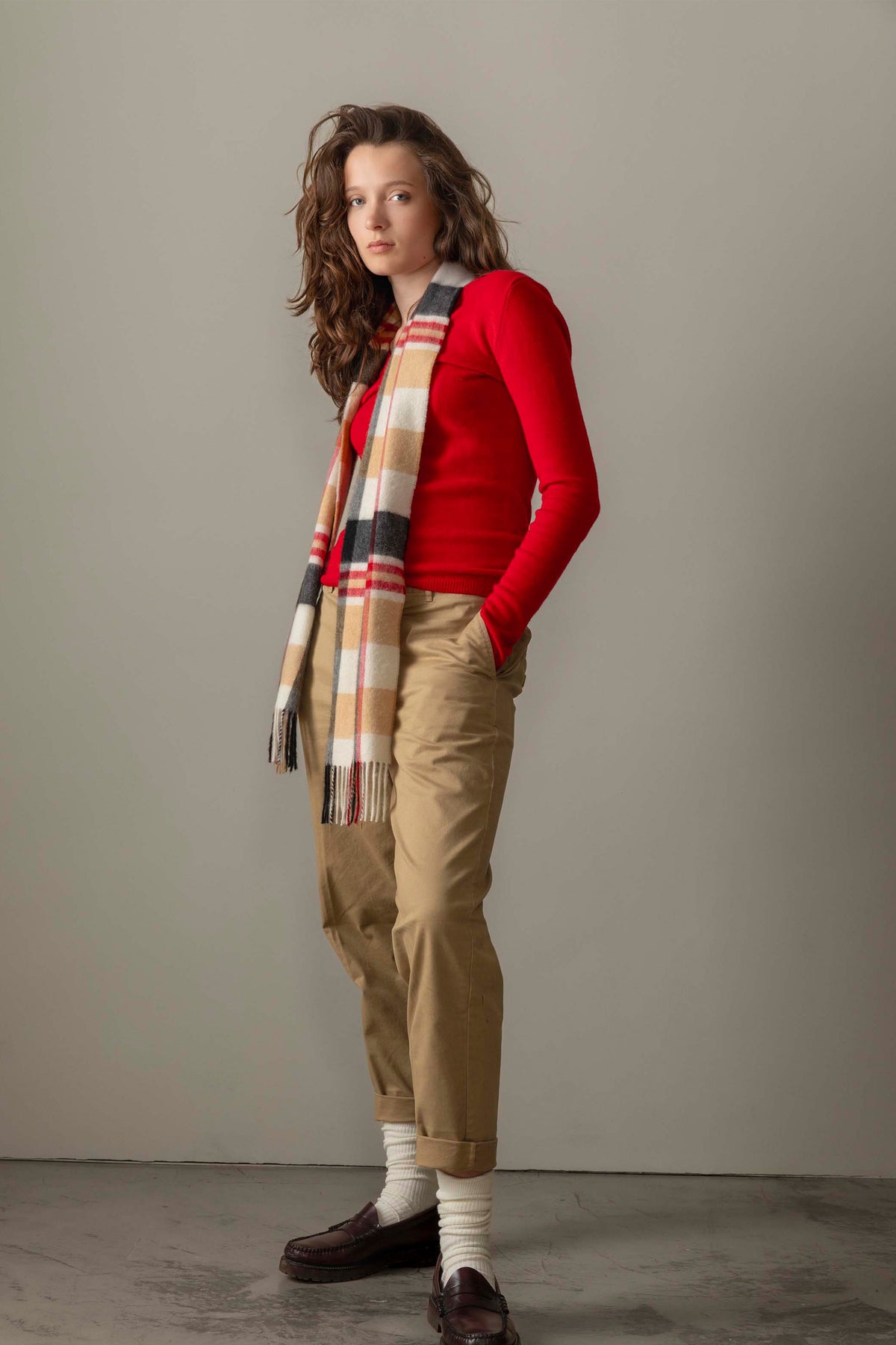 Women's Cashmere V Neck Jumper in Red styled with a plaid scarf, khaki chinos, and loafers for a full outfit look