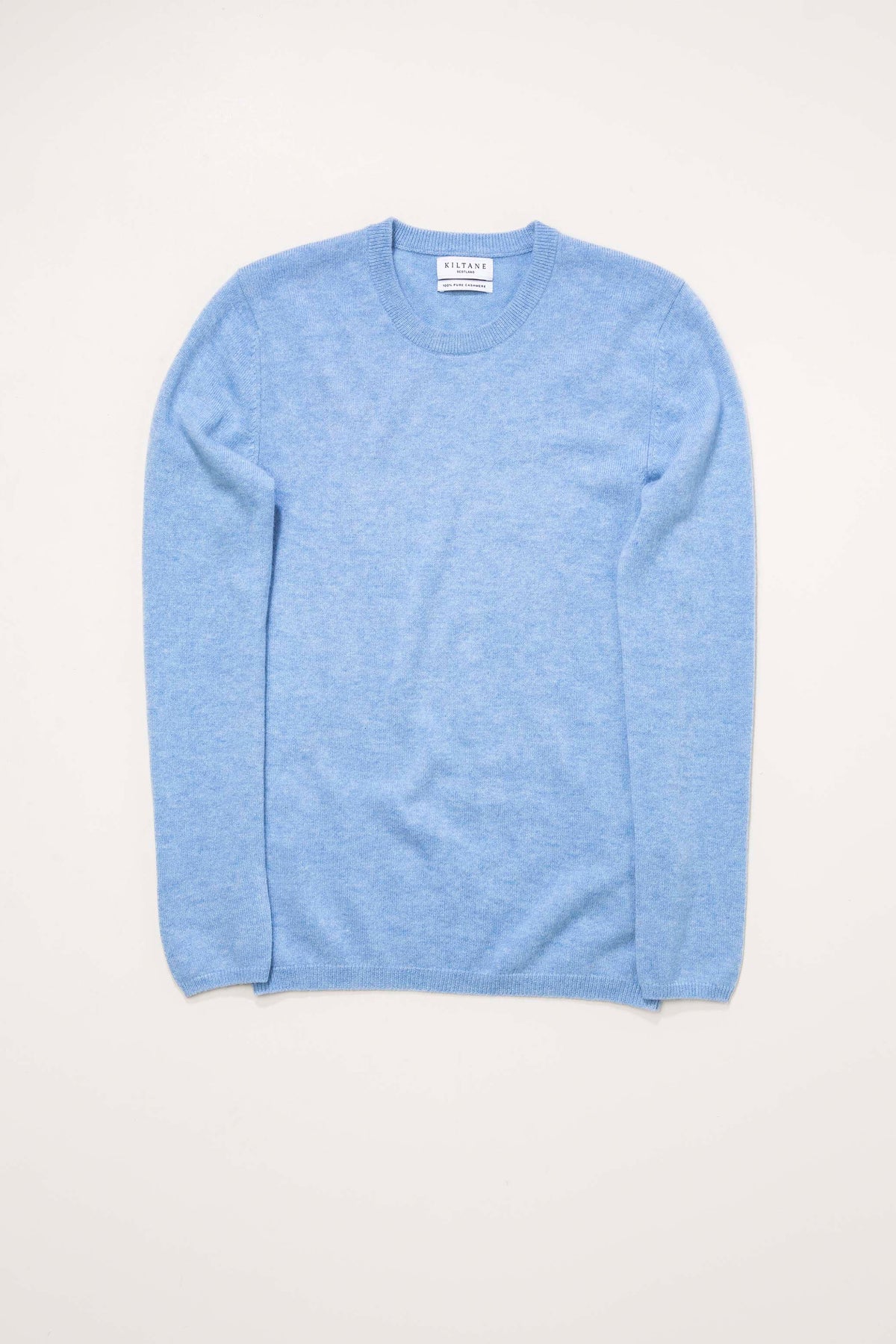 Kiltane Women's Cashmere Crew Neck Jumper in Glacier blue, flat lay front view showing ribbed neckline and cuffs
