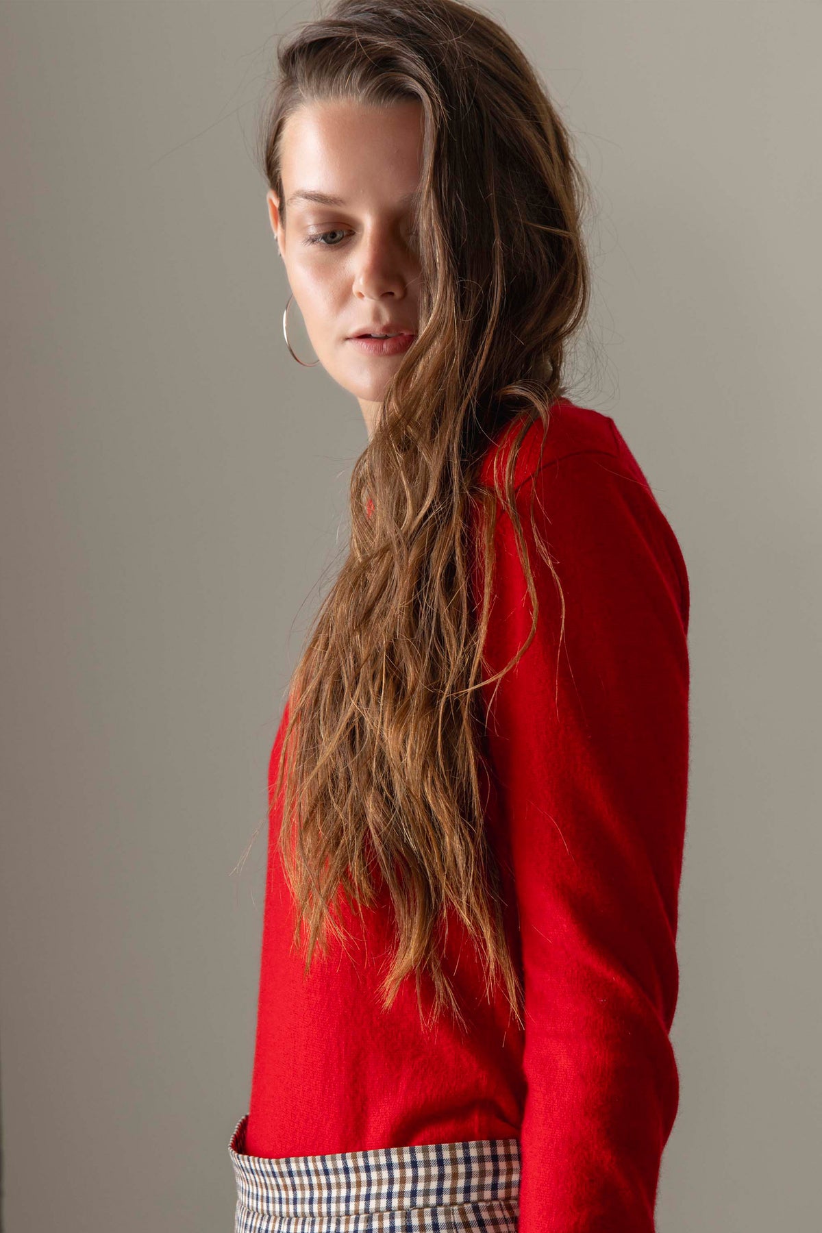 Women's Cashmere Crew Neck Jumper in Red — side profile showing soft cashmere texture and slim long sleeves