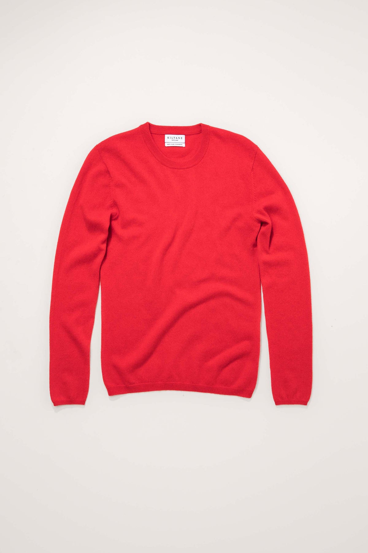 Kiltane Women's Cashmere Crew Neck Jumper in red, flat lay front view showing soft knit texture and ribbed cuffs