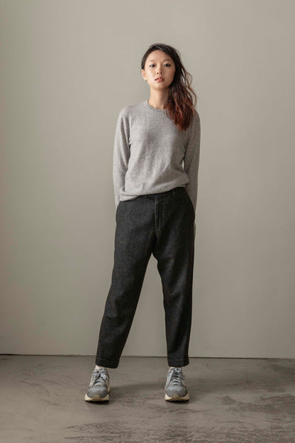 Women's Cashmere Crew Neck Jumper in light grey, slim fit with ribbed neckline and cuffs, styled with dark trousers