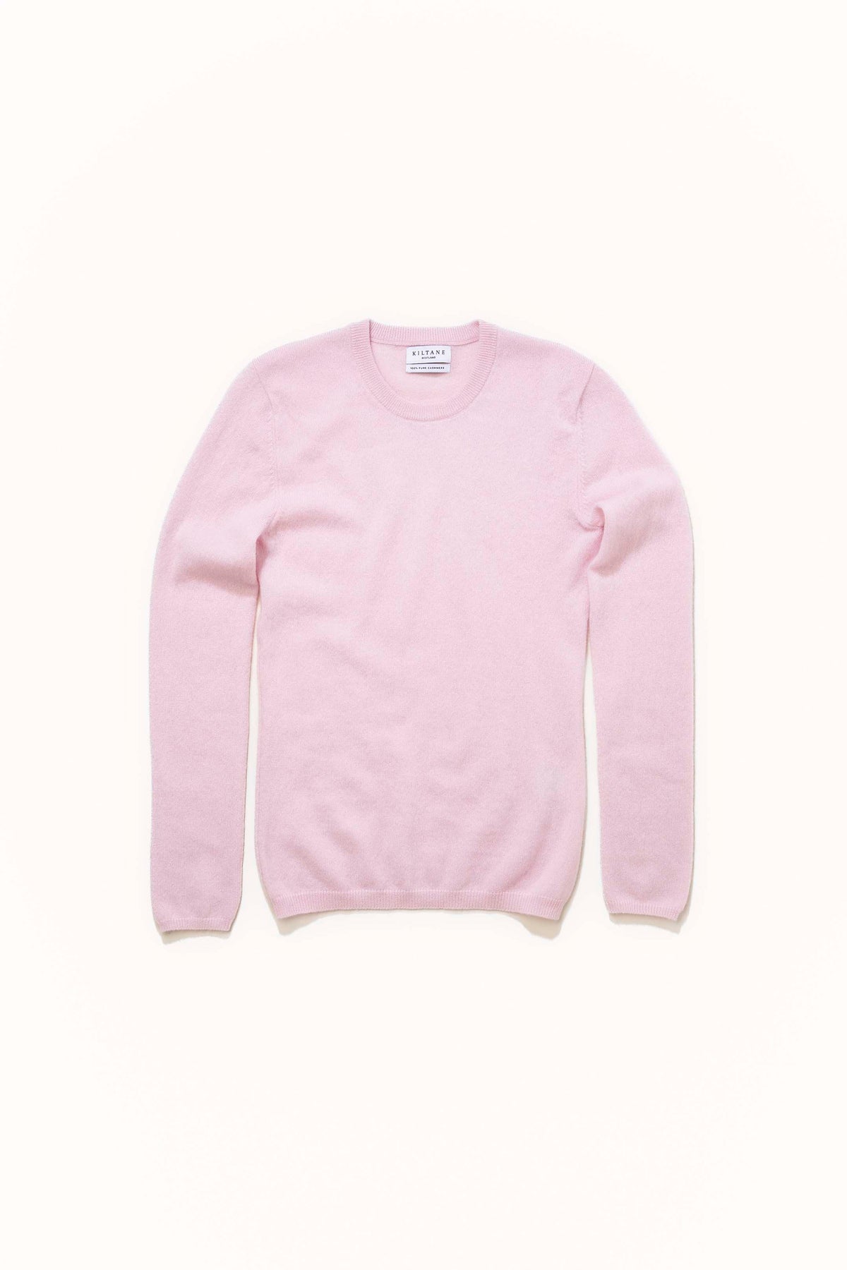 Kiltane Women's Cashmere Crew Neck Jumper in Pale Lilac laid flat, showing front view with ribbed cuffs and hem