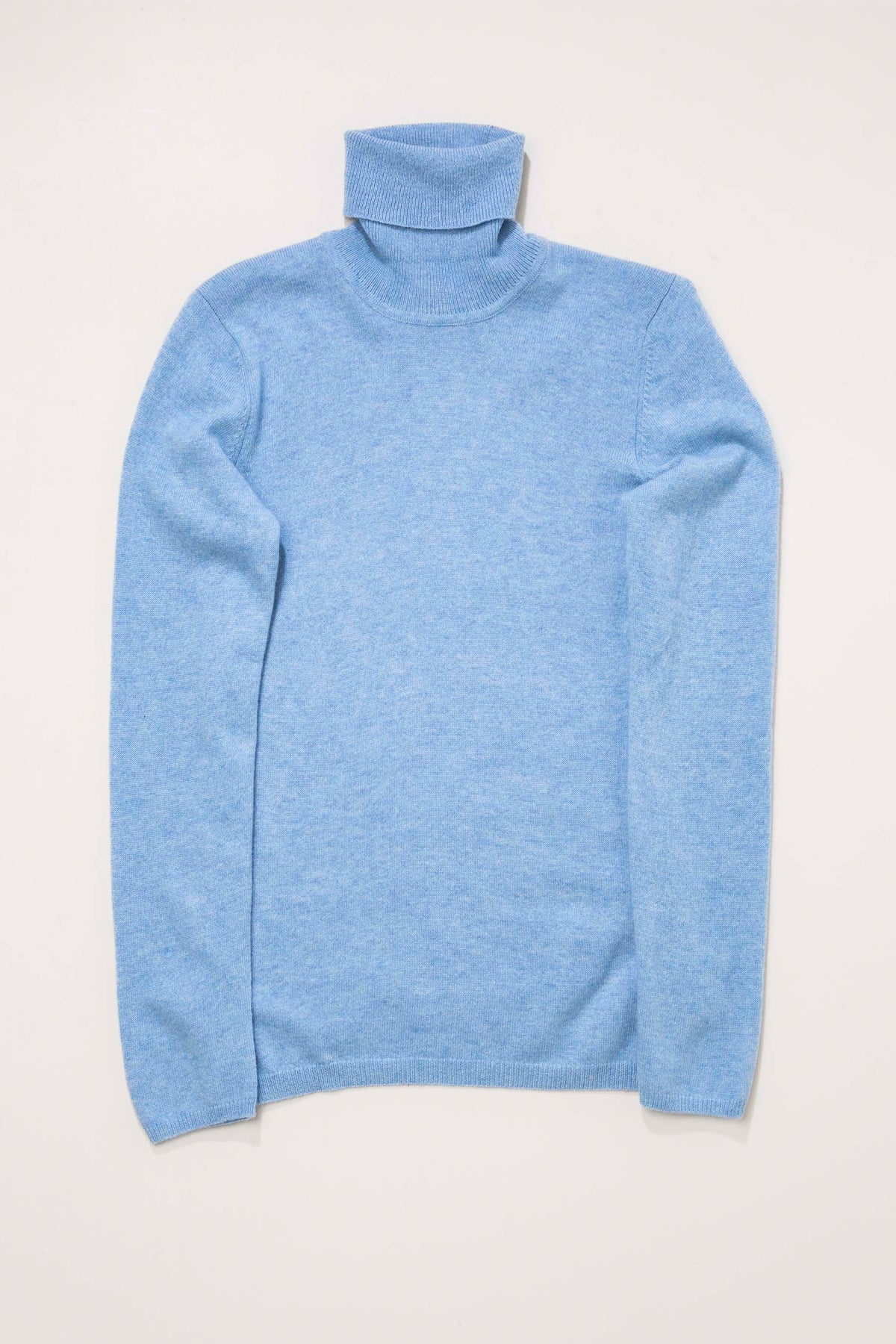 Women's Cashmere Polo Neck Jumper in Glacier blue, flat lay front view showing soft knit texture and folded turtleneck