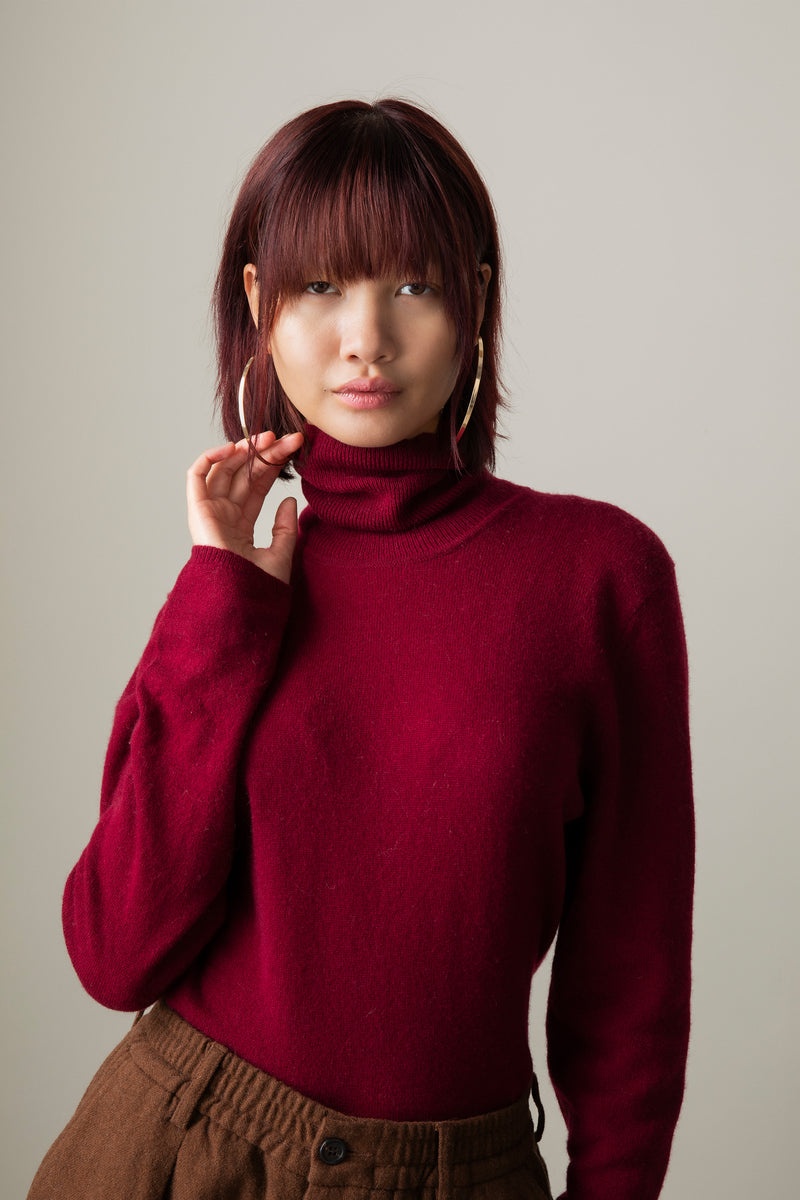 Women's Cashmere Polo Neck Jumper in Bordeaux — front view showing soft knit texture and fitted turtleneck collar