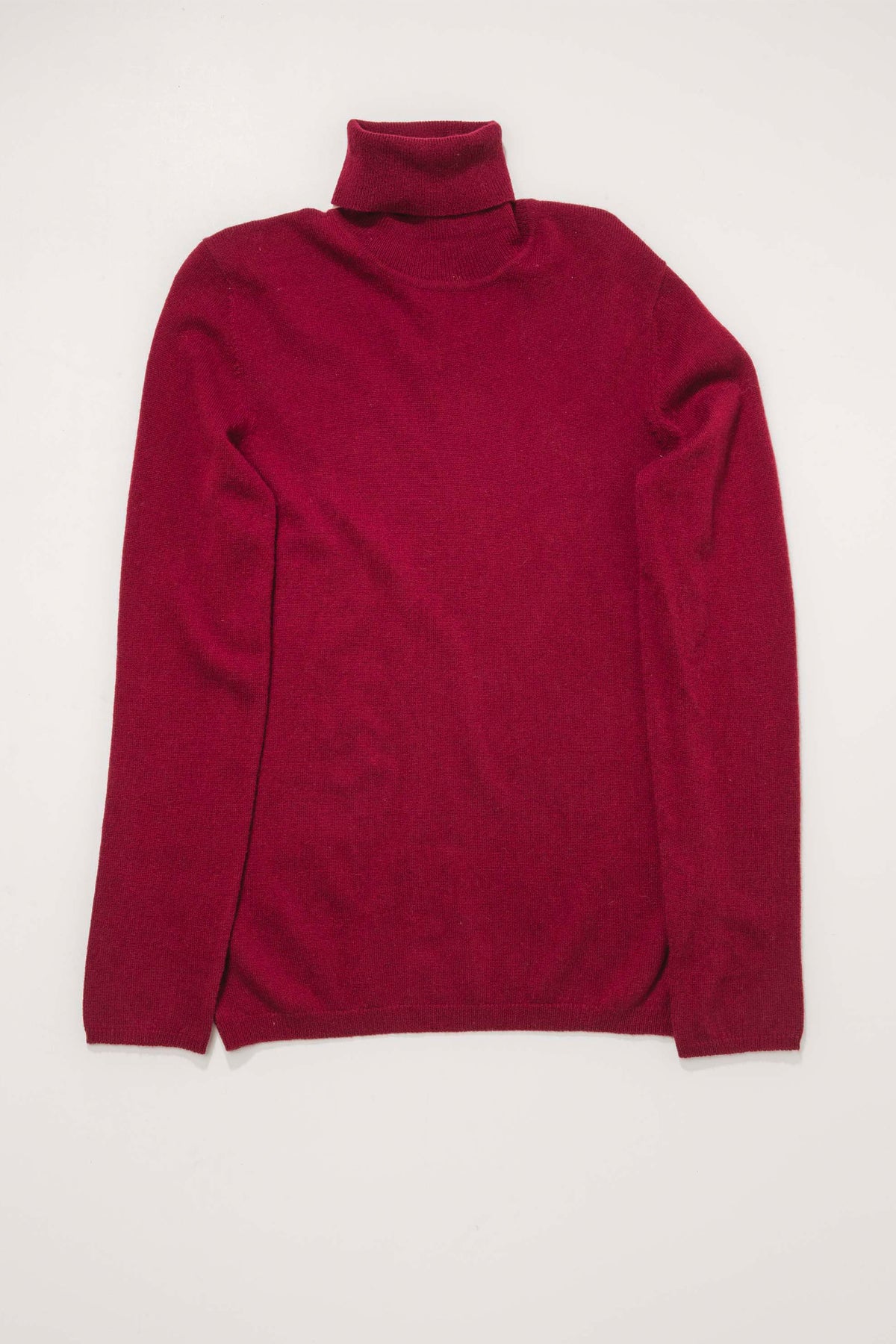 Women's Cashmere Polo Neck Jumper in Bordeaux laid flat, showing full front view with folded turtleneck collar