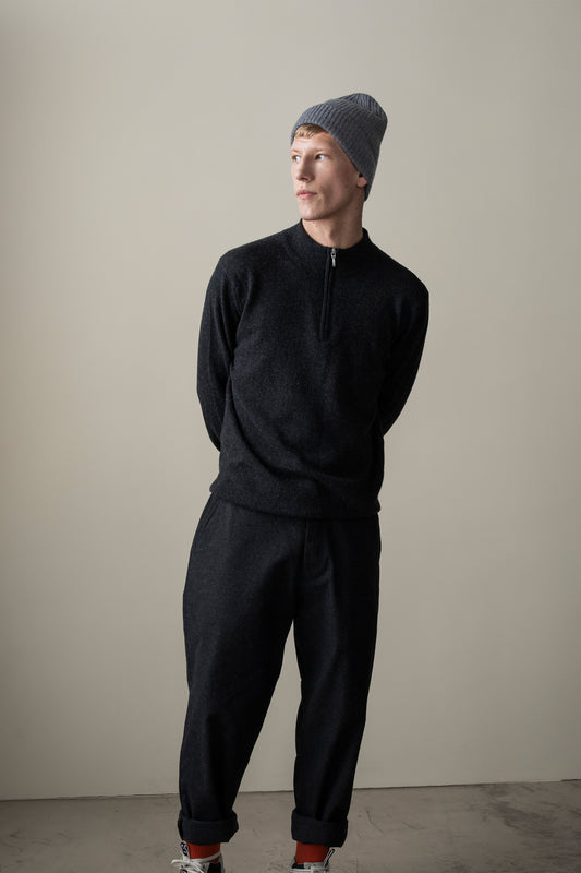 Men's Half Zip Jumper in charcoal cashmere with silver zip detail, modelled in a relaxed full-length front view