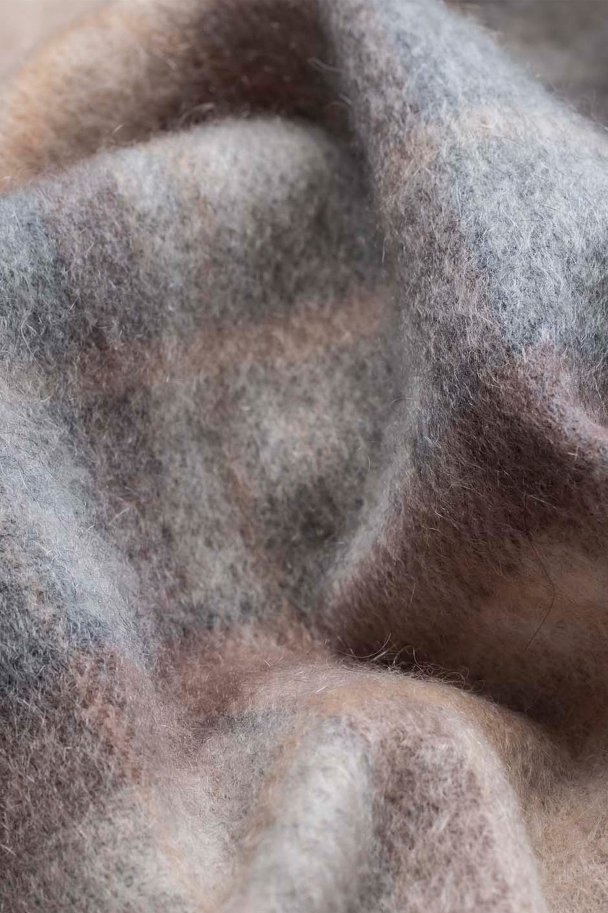 Close-up of the Mackellar Natural Heritage Cashmere Scarf showing soft brushed texture in muted grey, brown, and cream tones