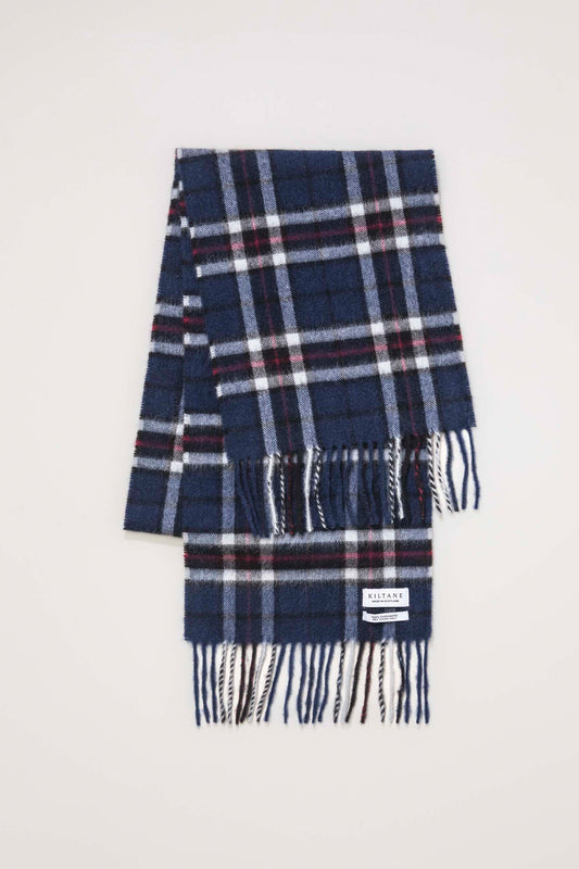 Kiltane Made In Scotland Scotty Thompson Cashmere Scarf in navy tartan plaid, folded flat showing brand label and fringed ends