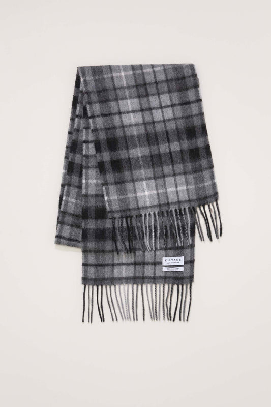 Kiltane Made In Scotland Heritage Cashmere Scarf in Buchanan Grey folded flat showing plaid pattern and fringed ends