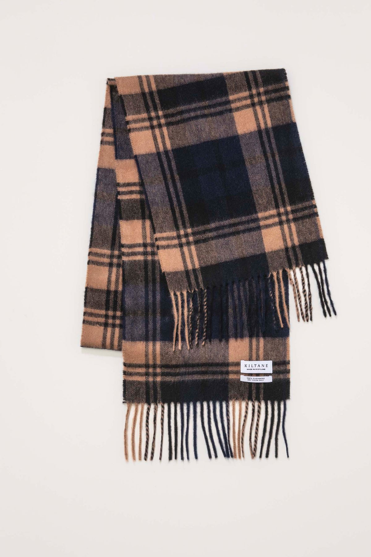 Kiltane Made In Scotland Heritage Cashmere Scarf in Port Blackwatch, folded flat showing plaid pattern with fringed ends