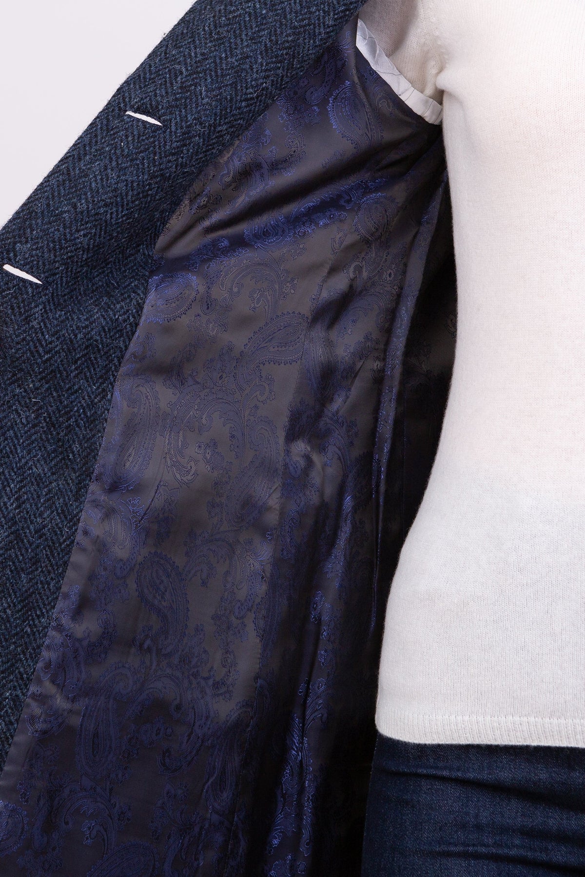 Women's Harris Tweed Tori Coat interior showing navy blue paisley satin lining with lapel pulled open