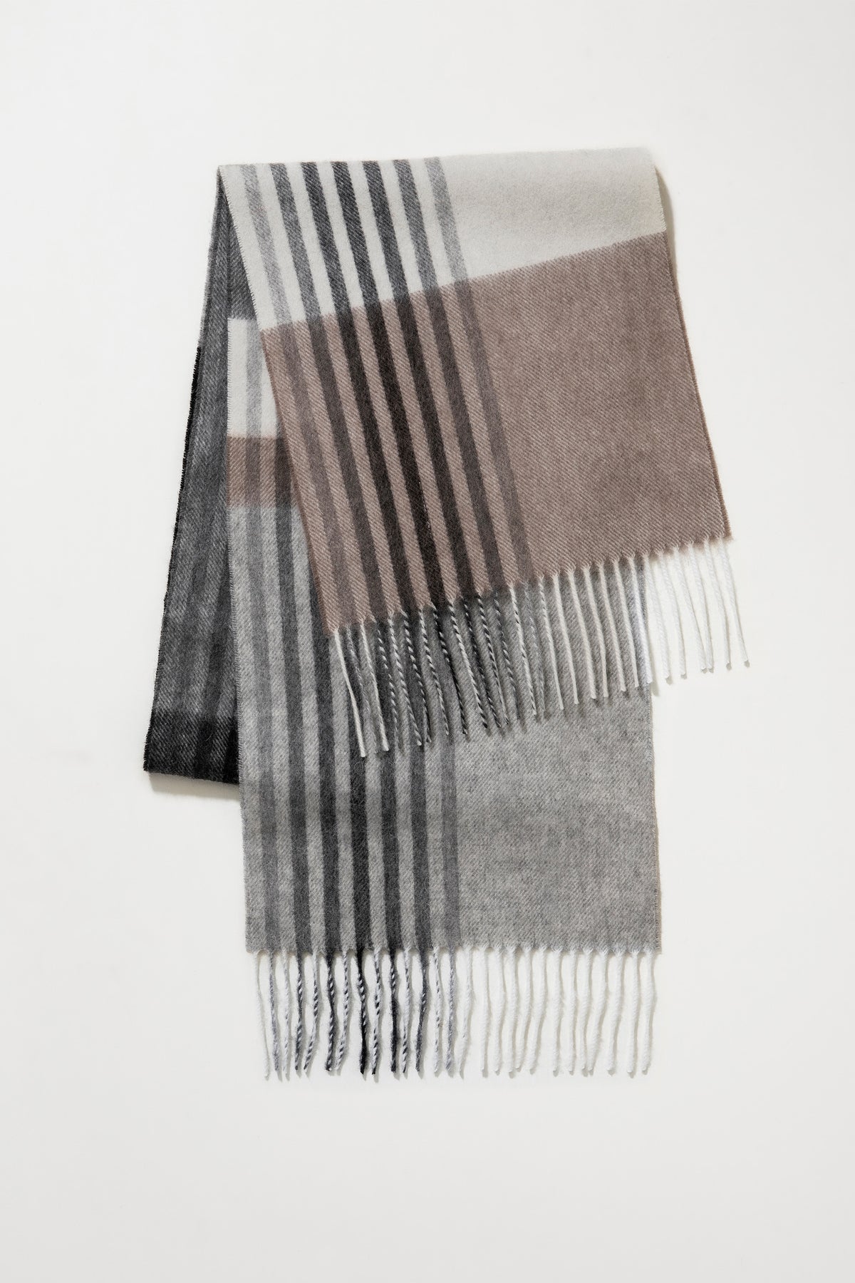 Contemporary Check Lambswool Scarf in Monochrome folded to show plaid pattern in grey, taupe, and black with fringed ends
