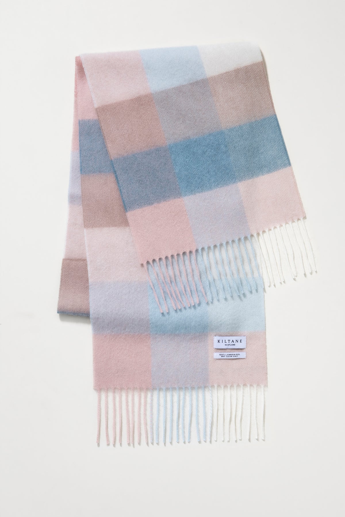 3 Square Check Lambswool Scarf in Seashell folded to show pastel pink, blue, and lilac check pattern with fringed ends