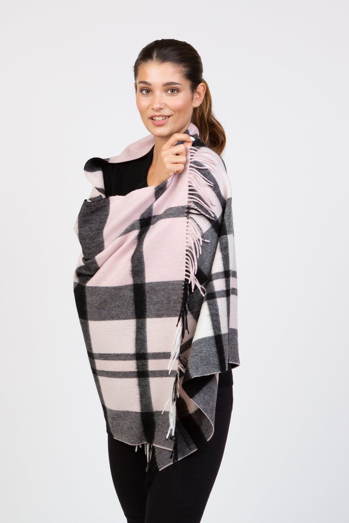Contemporary Exploded Thompson Lambswool Stole in baby pink and charcoal plaid, worn draped over shoulders with fringed edges