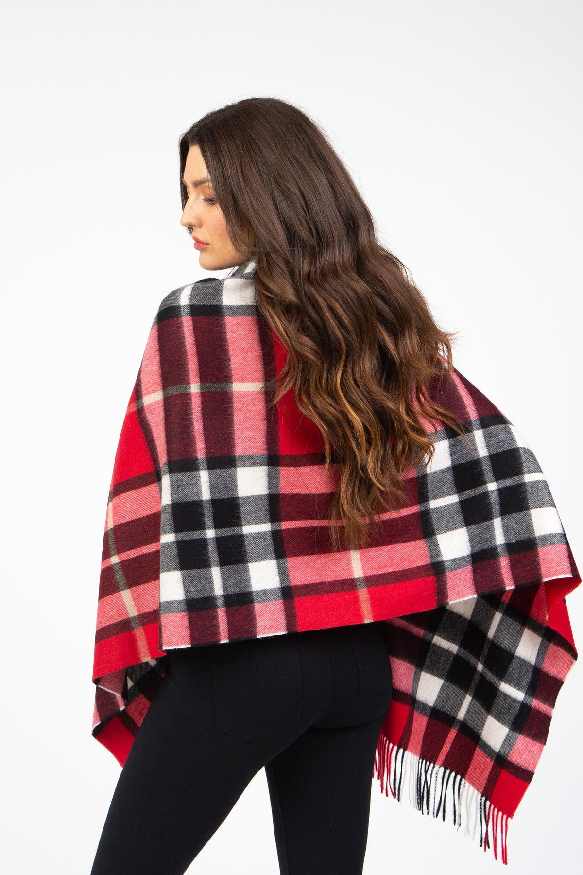 Back view of Scotty Thompson Lambswool Stole in Red, worn as a wrap showing the plaid pattern with fringed edges