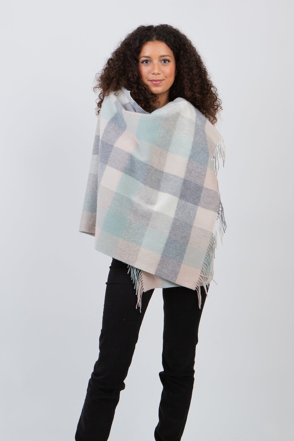 5 Square Check Lambswool Stole in Brume worn wrapped around shoulders, soft plaid in mint green, grey, and blush with fringed edges