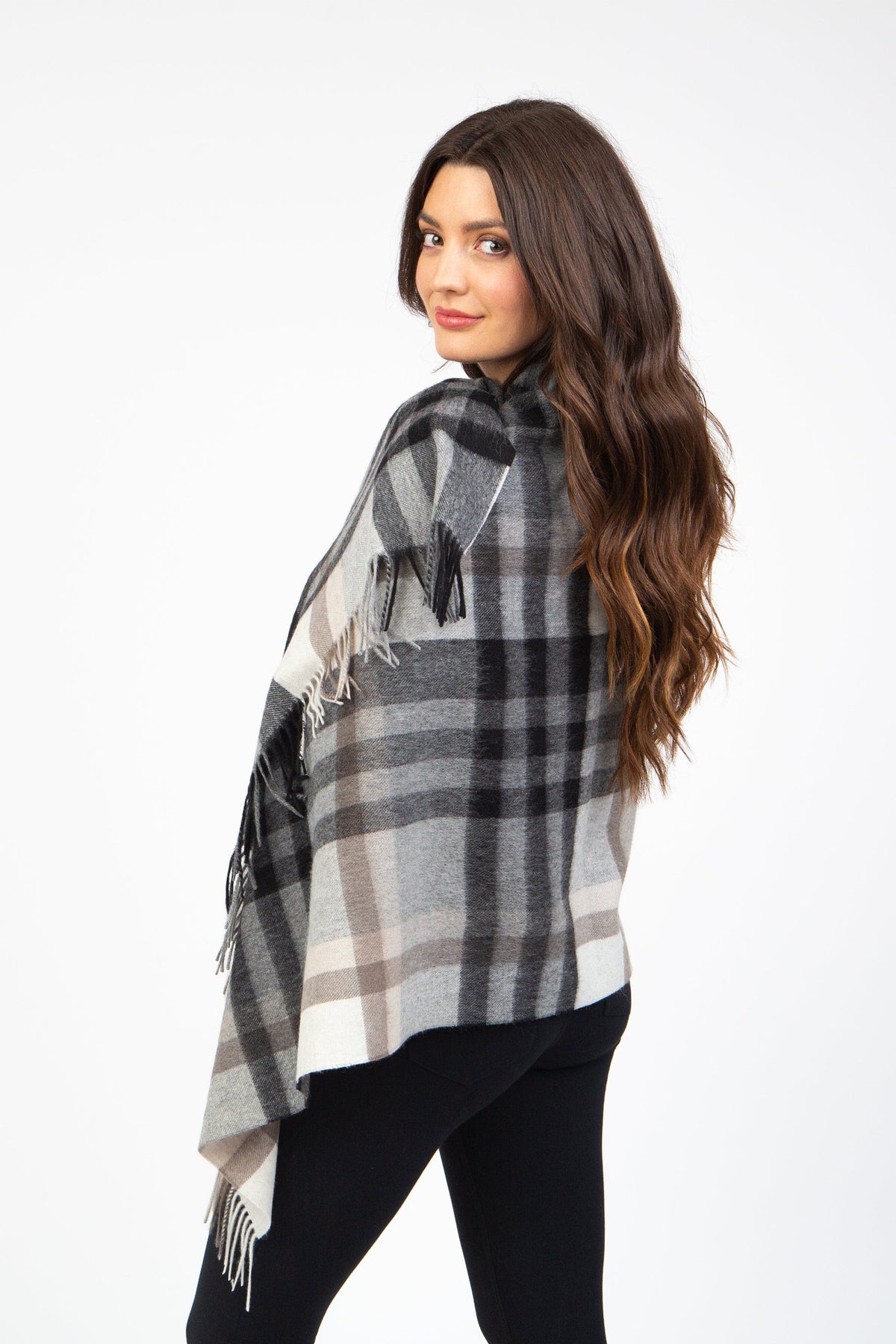 Tartan 2 Lambswool Stole in Black Grey shown from the back, draped over shoulders with fringed edges visible