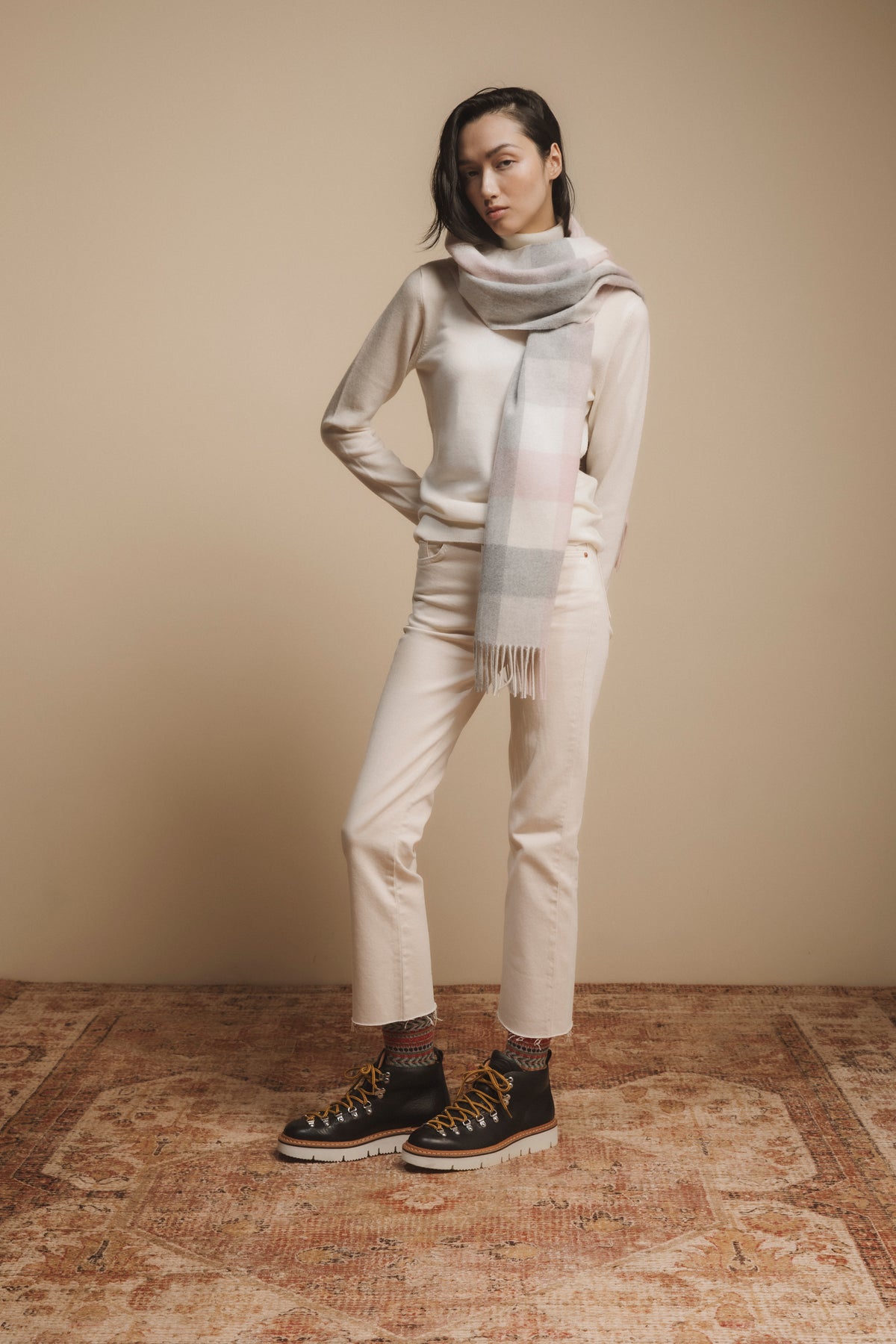 5 Square Check Cashmere Wide Scarf in Cherub, soft pink and grey check pattern with fringed ends, styled around the neck
